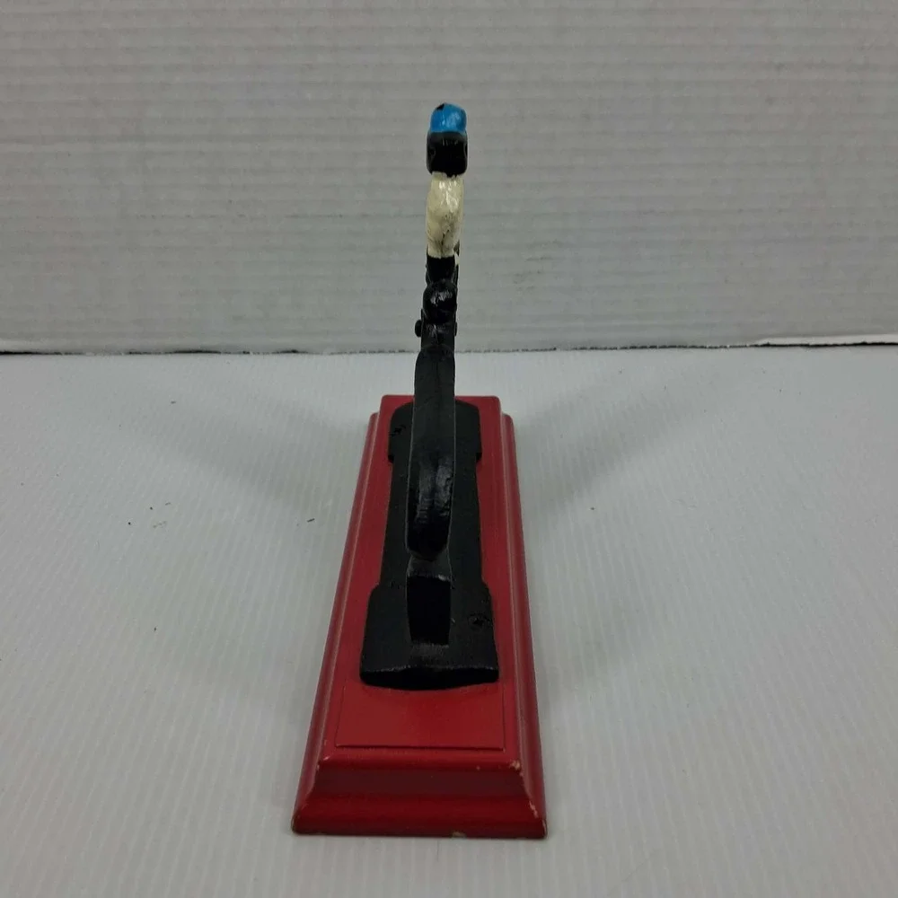 Vintage Cast Iron Mechanical Nutcracker Soldier Figure on Red Wood‎ Base Black